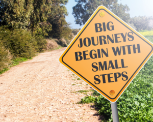 A journey begins with a small step sign